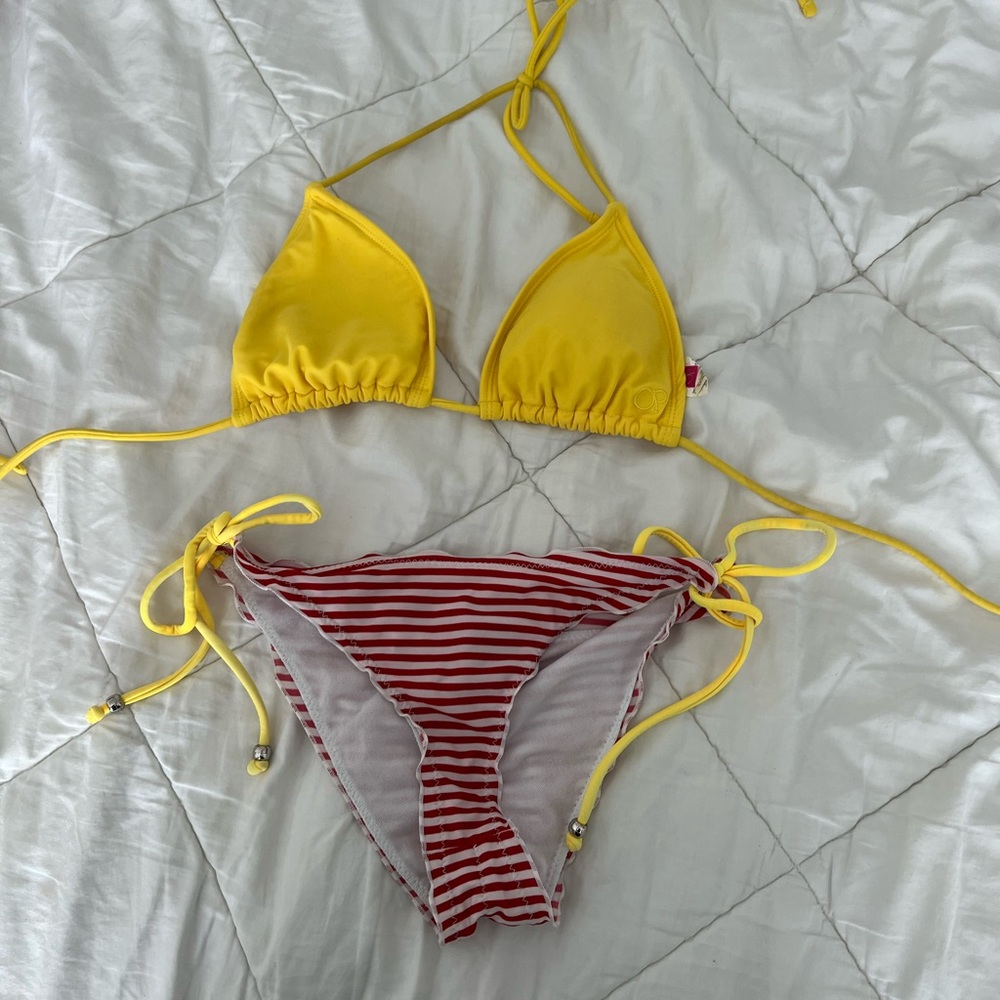 Red and white striped bottoms. Yellow triangle bikini top. Fun country swimwear